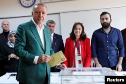 FILE - Turkish President Recep Tayyip Erdogan casts his ballot at a polling station during municipal elections in Istanbul, March 31, 2019.