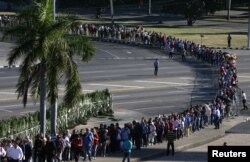 People wait in line to pay tribute to Cuba's late President Fidel Castro at the Jose Marti Memorial in Revolution Square in Havana, Cuba, Nov. 29, 2016.