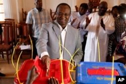 Former Prime Minister Anicet Georges Dologuele casts his ballot in the second round of presidential election and the first round of legislative elections in Bangui, Central African Republic, Feb. 14, 2016.