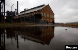 FILE - An abandoned steel blast furnace is seen in Pittsburgh, Pennsylvania, April 8, 2011. The city is shifting from a fossil fuel-based economy to a greener one.