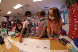Students work with numbers at Pfluger Elementary School, in Buda, Texas. (Courtesy Moses Leos, Hays Consolidated Independent School District)