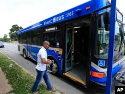 Syrian refugee Ahmad Alabood gets on a bus following English class at Della Lamb Community Services in Kansas City, Mo., on June 13, 2016.