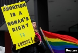 An anti-Trump demonstrator protests at an abortion rights rally in Chicago, Illinois, Jan. 15, 2017.