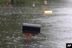 A mailbox on Mill Creek Road is barely above water after Florence hit Newport, N.C., Sept. 15, 2018. A day after blowing ashore, Florence practically parked itself over land all day long and poured on the rain.