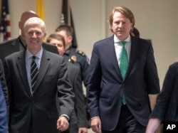 FILE - President Trump's White House counsel, Don McGahn, right, is seen on Capitol Hill in Washington, Feb. 6, 2017.