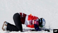 Czech Republic's Eva Samkova celebrates after taking the gold medal in the women's snowboard cross final at the Rosa Khutor Extreme Park, at the 2014 Winter Olympics, Sunday, Feb. 16, 2014, in Krasnaya Polyana, Russia.