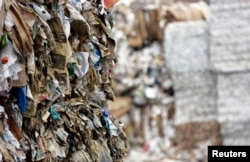 FILE - Bundled recyclables are seen outside the Pratt Industries corrugated box facility in the borough of Staten Island in New York, July 30, 2008. The facility converts waste paper collected from the streets of New York into 100 percent recycled corrugated boxes.
