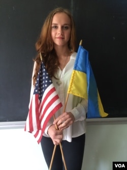 Xenia Vitovych, who was born in Ukraine, takes fierce pride in her homelands, both new and old. She volunteers for the Patriot Defense, which helps the Ukrainian army with funds and supplies, New York, Sept. 10, 2014 (Adam Phillips/VOA).