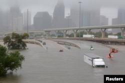 Interstate 45 is submerged from rain that arrived with Harvey in Houston, Texas, Aug. 27, 2017. With the heavy precipitation expected to last for days, it's still unclear how bad the damage will be, but there is already evidence of widespread losses.