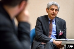 FILE - BBC Persian correspondent Kasra Naji speaks during an interview in Geneva, Switzerland, March 12, 2018.