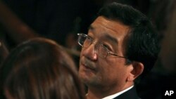 Chinese Ambassador to Malaysia Huang Huikang listens during a press conference in Sepang, Malaysia, March 12, 2014.