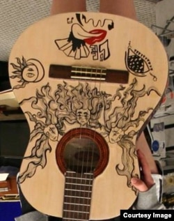 Three Sisters Heads Guitar by Carla Araneda (Courtesy Victor Litz Music Center)