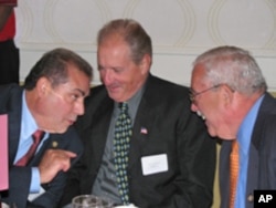 Saba Shami (left), founder of the Arab American Democratic Caucus, speaks with Virginia Congressman Jerry Connolly (right).