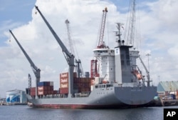 FILE - The container ship Tropic Carib is shown docked at the Port of Palm Beach in Riviera Beach, Florida, July 13, 2016.