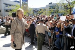 Democratic presidential candidate Hillary Clinton addresses supporters in the overflow area during a campaign event at the Los Angeles Southwest College, in Los Angeles, April 16, 2016.