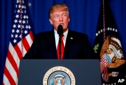 FILE - U.S. President Donald Trump speaks after the U.S. fired a barrage of cruise missiles into Syria Thursday night in retaliation for this week's gruesome chemical weapons attack against civilians, at Mar-a-Lago in Palm Beach, Florida, April 6, 2017.