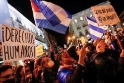 People take part in a protest to support Cuban dissidents and to demand human rights in Cuba, at Puerta del Sol square in Madrid, Spain, November 15, 2021.