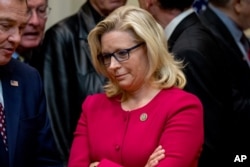 FILE - Rep. Liz Cheney, R-Wyo, waits for President Donald Trump to arrive to sign various bills in the Roosevelt Room of the White House, March 27, 2017, in Washington.