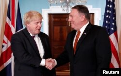 U.S. Secretary of State Mike Pompeo, right, meets with British Foreign Secretary Boris Johnson at the State Department in Washington, May 7, 2018.