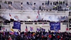 In this Wednesday, Jan. 6, 2021, file photo, violent protesters, loyal to President Donald Trump, storm the Capitol, in Washington. (AP Photo/John Minchillo, File)