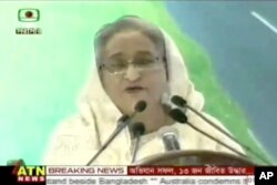 In this image from video provided by ATN News, Bangladesh's Prime Minister Sheikh Hasina delivers a speech regarding the militant hostage-taking at a restaurant in Dhaka, July 2, 2016. Hasina condemned the attack, which was claimed by the Islamic State gr