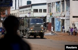 Members of the military patrol the streets of the capital Harare, Aug. 2, 2018.