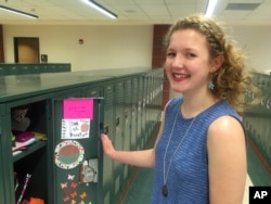 High school student Dana Craig, 15, stands at her locker in River Falls, Wisconsin, May 31, 2016.