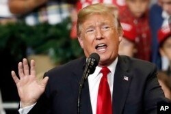FILE - President Donald Trump speaks at a rally in Biloxi, Miss., Nov. 26, 2018.