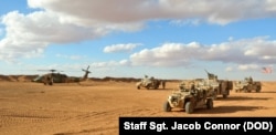 FILE - 5th Special Forces Group (A) Operation Detachment Bravo 5310 arrives to meet Major General James Jarrard at the Landing Zone at base camp Al Tanf Garrison in southern Syria.