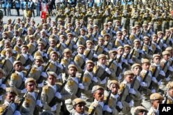 FILE - Iranian army troops march in a parade marking National Army Day just outside Tehran, Iran, April 17, 2016.