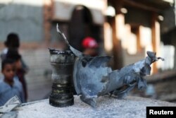 The remains of an exploded missile are seen near a house damaged by overnight shelling in Abu Salim district, Tripoli, Libya, April 17, 2019.