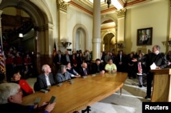 FILE - Judd Choate (R), state election director for Colorado and president of the National Association of State Election Directors, addresses Colorado Electoral College electors at the State Capitol in Denver, Dec. 19, 2016.