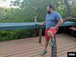 Daniel Ernesto Villarreal, a bail bondsman from Rio Grande City, Texas, looks out into his 16-acres of property near the river. (R. Taylor/VOA)