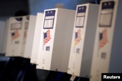 FILE - Voting booths are ready for the New York primary elections at a polling station in the Brooklyn borough of New York City, April 19, 2016. U.S. voters go to the polls November 8 to elect a new president and members of Congress.