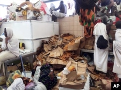 Muslim pilgrims gather around the bodies of people crushed in Mina, Saudi Arabia during the annual hajj pilgrimage on Thursday, Sept. 24, 2015.