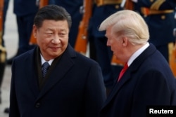 FILE - U.S. President Donald Trump takes part in a welcoming ceremony with China's President Xi Jinping at the Great Hall of the People in Beijing, China, Nov. 9, 2017.