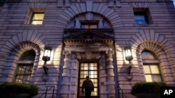 FILE - A man walks up the steps of the 9th U.S. Circuit Court of Appeals building, Feb. 9, 2017, in San Francisco. A federal appeals court refused to reinstate President Donald Trump's ban on travelers from seven predominantly Muslim nations.