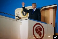 U.S. President Donald Trump arrives at Paya Lebar Air Base for a summit with North Korea's leader Kim Jong Un, June 10, 2018, in Singapore.