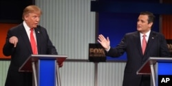 Republican presidential candidate businessman Donald Trump, left, and rival Sen. Ted Cruz, R-Texas, both speak during the Fox Business Network Republican presidential debate at the North Charleston Coliseum, Jan. 14, 2016, in North Charleston, S.C.
