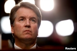 FILE - U.S. Supreme Court nominee Brett Kavanaugh listens during his Senate Judiciary Committee confirmation hearing on Capitol Hill in Washington, Sept. 4, 2018.