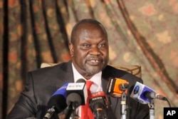 FILE - South Sudan rebel leader Riek Machar addresses journalists during a news conference in Nairobi, Kenya, July 8, 2015.
