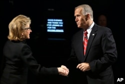 Sen. Kay Hagan, D-N.C., left, and North Carolina Republican Senate candidate Thom Tillis shake hands prior to an Oct. 7 debate.