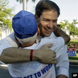 Republican U.S.Senate candidate Marco Rubio greets a supporter at an early voting location in Miami, 20 Oct 2010
