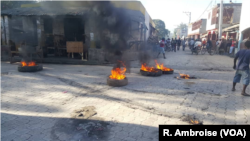 Flaming tires seen early on Feb. 11, 2019, in the streets of Hinche in the center of Haiti.