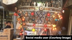 A traditional Iranian mourning fixture known as a hejleh is displayed on a street in Karaj, Iran, to commemorate Reza Otadi, killed during an antigovernment protest in the city on August 3, 2018.