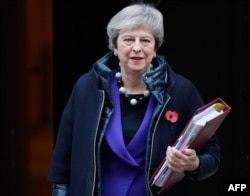 Britain's Prime Minister Theresa May leaves 10 Downing Street in London on Oct. 31, 2018, ahead of the weekly Prime Minister's Questions session in the House of Commons.