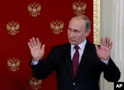 Russian President Vladimir Putin reacts during a joint press conference with Italian counterpart Sergio Mattarella after a meeting in Moscowís Kremlin, Russia, April 11, 2017. S
