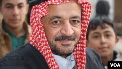 Sheikh Mohammad Abu Omar, a local leader in the village of Bashmana, says that before Hashd Shaabi captured their village, they feared sectarian violence from the predominantly Shia forces, but those fears have since been allayed Bashmana, Iraq, Dec. 16, 2016. (H. Murdock/VOA)