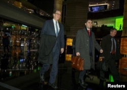 Under Secretary for International Affairs David Malpass of the U.S. Department of the Treasury and other members of the U.S. trade delegation to China, return from talks to a hotel in Beijing, China, Jan. 7, 2019.