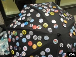 A vendor displays buttons for sale at the New York City protest march against President Donald Trump's refusal to release his tax returns, April 15, 2017.